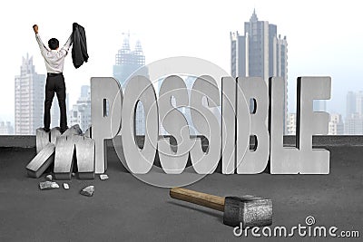 Cheer bussinessman stand on crushing impossible 3D concrete word Stock Photo