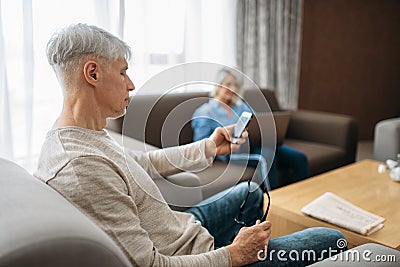 Cheerful adult love couple resting at home Stock Photo