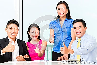 Asian Chinese financial consultants in office Stock Photo