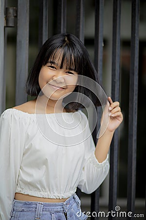 Cheerful asian teenager happines smiling face standing outdoor Stock Photo