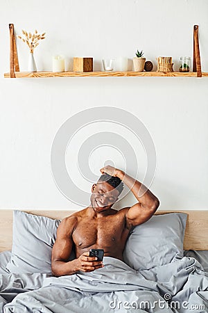 cheerful athletic african american man browsing Stock Photo