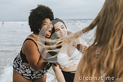 Cheerful beautiful plus size women at the beach Stock Photo