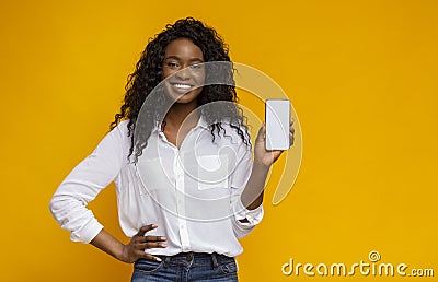 Cheerful black woman showing latest slim cellphone Stock Photo