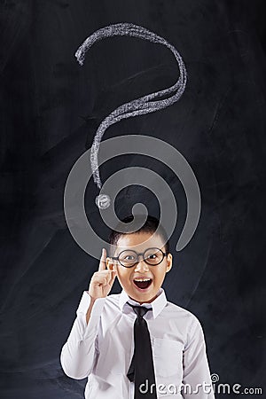 Cheerful boy with question mark Stock Photo