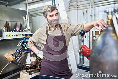 Cheerful Brewer at Work Stock Photo