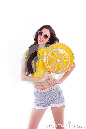 Cheerful Bright Girl in glasses with a yellow balloon on an isolated white background. Stock Photo