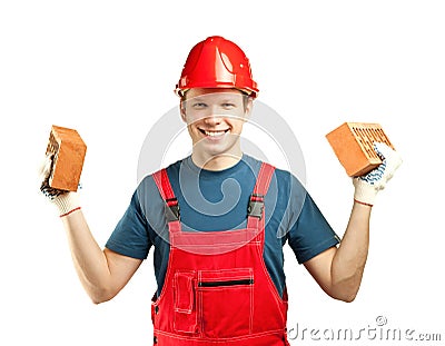Cheerful builder holding bricks Stock Photo