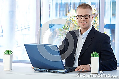 Cheerful businessman in office Stock Photo