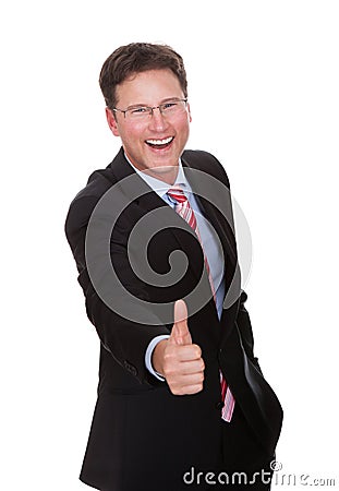 Cheerful Businessman Showing Thumbsup Stock Photo