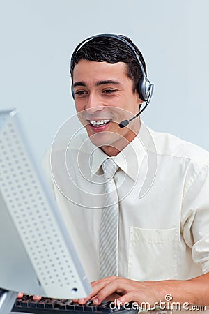 Cheerful businessman using headset Stock Photo