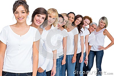 Cheerful casual models posing in a line looking at camera Stock Photo