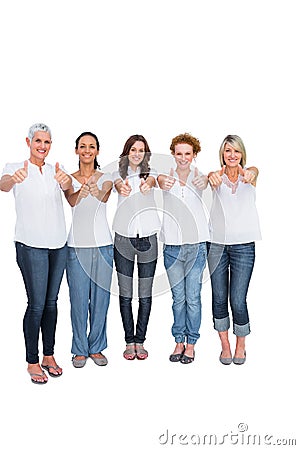 Cheerful casual models with thumbs up Stock Photo