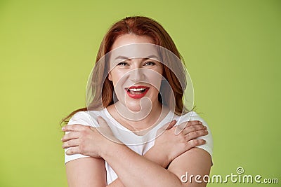 Cheerful charismatic happy good-looking redhead woman red lipstick cross hands chest smiling motivated excited having Stock Photo