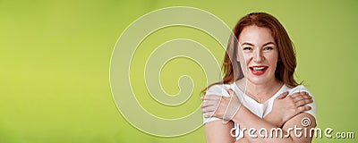 Cheerful charismatic happy good-looking redhead woman red lipstick cross hands chest smiling motivated excited having Stock Photo