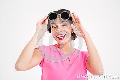 Cheerful charming young woman in sunglasses Stock Photo