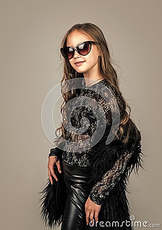 cheerful child in glasses with curly hairdo, beauty Stock Photo