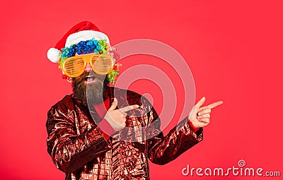 Cheerful clown colorful hairstyle. Winter holidays. Sorry Santa, Naughty just feels Nice. Bearded man celebrate Stock Photo