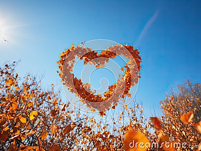 A cheerful colorful banner with a big heart made of golden leaves for the design. Generated by Stock Photo