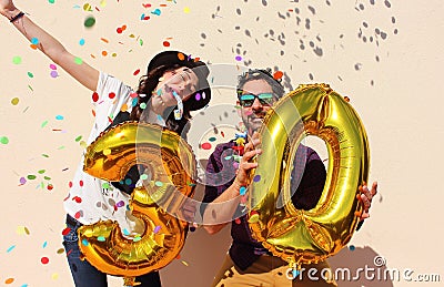 Cheerful couple celebrates a thirty years birthday Stock Photo