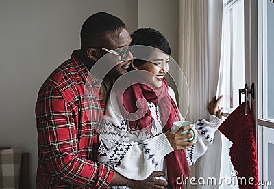 A cheerful couple enjoying Christmas holiday Stock Photo