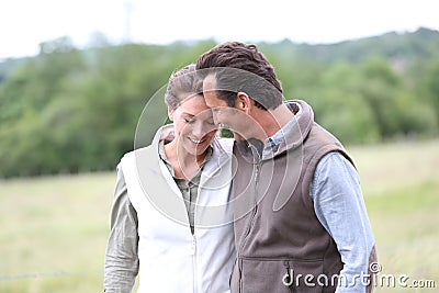 Cheerful couple of framers taking a walk Stock Photo