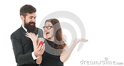 Cheerful couple. happy valentines day. formal couple in love. man present ring to woman. marry me. offer engagement ring Stock Photo