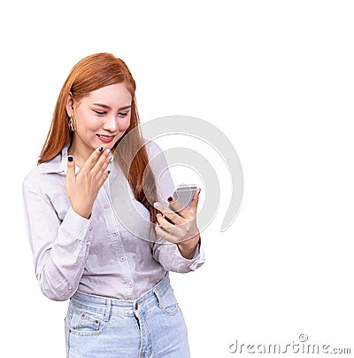 Cheerful cute beautiful young Asian woman chatting with friend in social network by mobile phone ,feeling surprised isolated Stock Photo