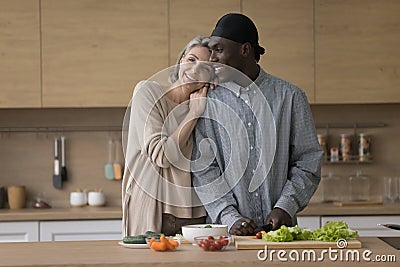 Cheerful cute diverse mature couple keeping healthy lifestyle Stock Photo