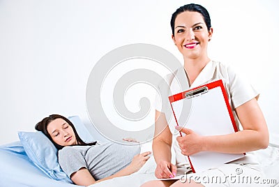 Cheerful doctor with pregnant patient Stock Photo