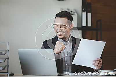 Cheerful due to success in work, Entrepreneurs joyful because business is prospering, Businessman working happily in office at Stock Photo