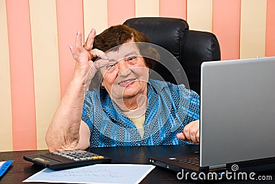 Cheerful elderly executive showing okay sign hand Stock Photo