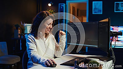Cheerful engineer excited after finding no errors in code Stock Photo