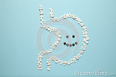 Cheerful face in stomach of pills. Healthy lifestyle, good digestion Stock Photo