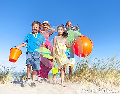 Cheerful Family Bonding by the Beach Stock Photo