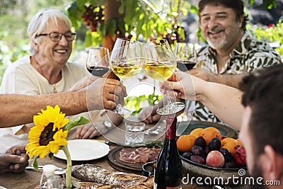 Cheerful family cheering with wine Stock Photo