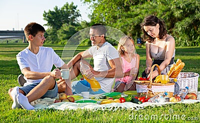 Cheerful family picnicking Stock Photo