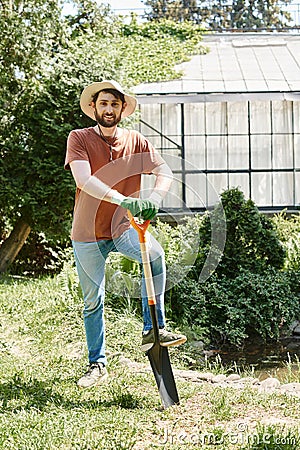 cheerful farmer with beard wearing sun Stock Photo