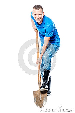 Cheerful farmer digging the earth Stock Photo