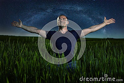 Cheerful farmer under the stars Stock Photo