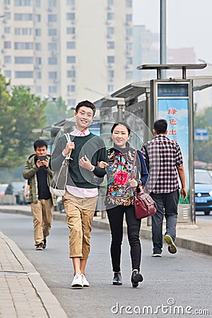 Cheerful fashionable young couple, Beijing, China Editorial Stock Photo