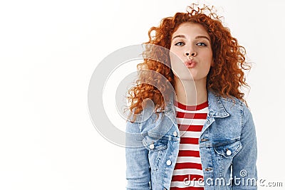 Cheerful flirty redhead caucasian girlfriend reaching camera give tender romantic muah folding lips waiting kiss Stock Photo