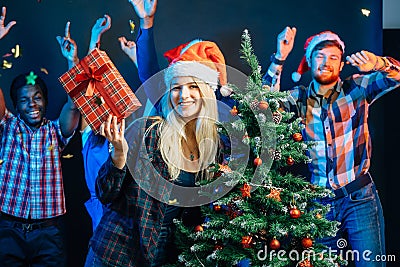 Friends makes fun on Christmas holyday with christmas tree Stock Photo