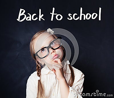 Cheerful funny girl thinking. Back to school and education Stock Photo