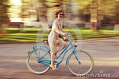 Cheerful girl on a bicycle Stock Photo