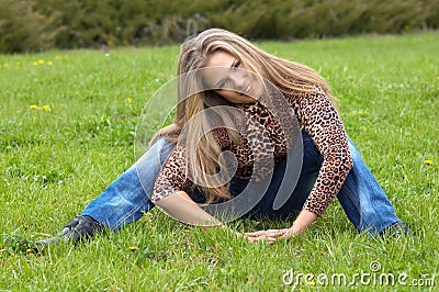 Cheerful girl on the grass Stock Photo