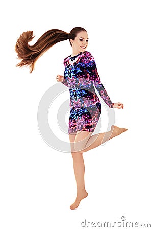 Cheerful girl with very long hair. Jump. The concept of lifestyle, fashion, health. Stock Photo