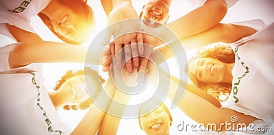 Cheerful group of volunteers putting hands together Stock Photo