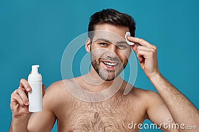 Cheerful Handsome Naked Guy Smiling At Camera While Doing Morning