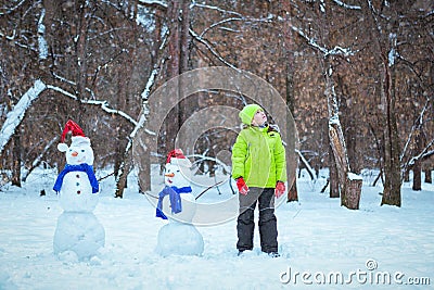 Cheerful happy boy playing in winter park, Stock Photo