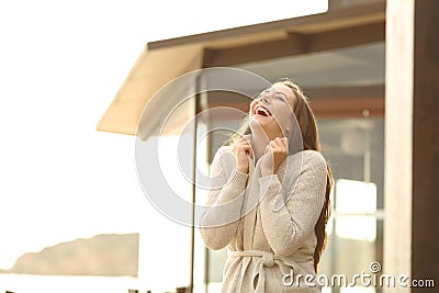 Cheerful hotel guest breathing fresh air Stock Photo